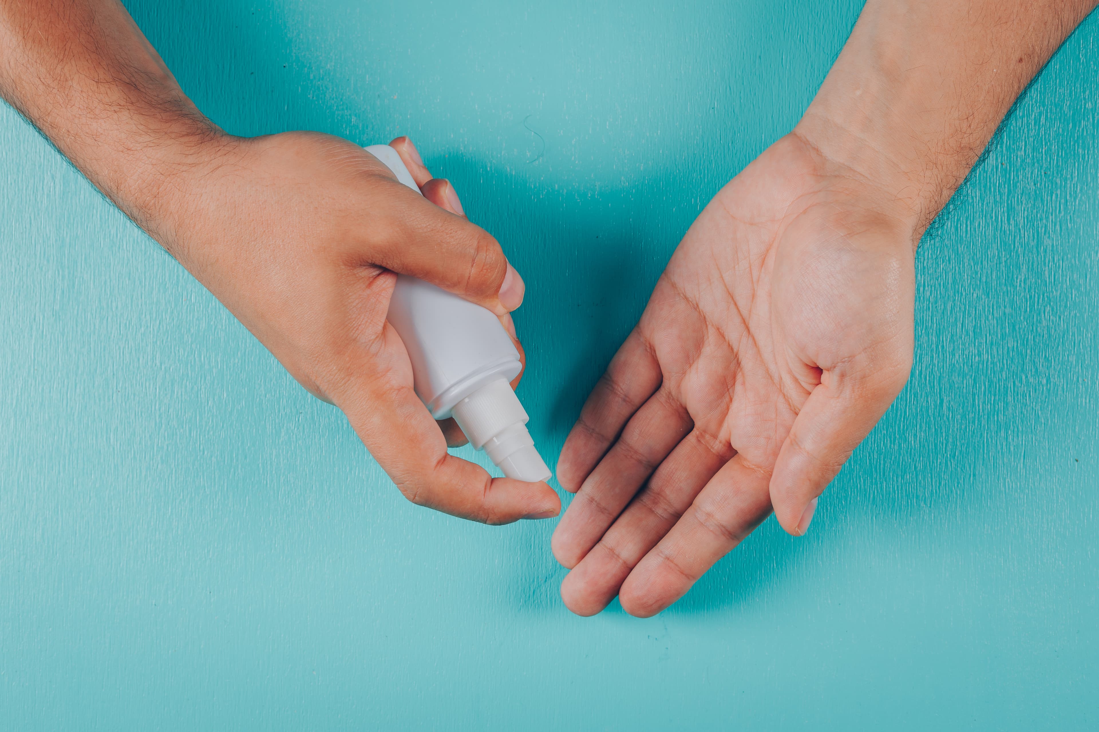 Technician sanitising tools and surfaces